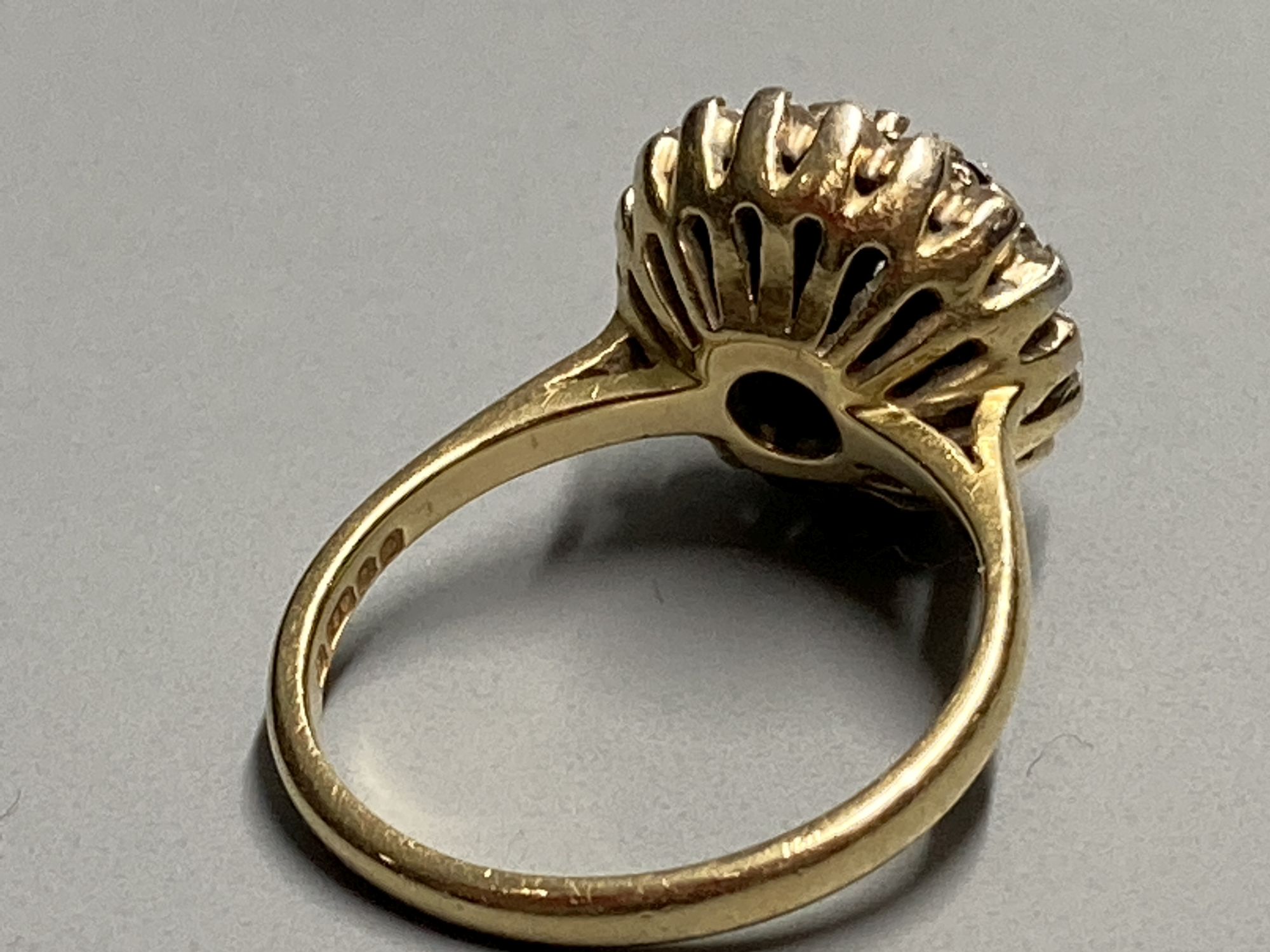 A modern 18ct gold, sapphire and diamond cluster dress ring, size K, gross 5.2 grams.